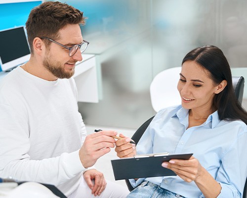 A woman confirming the cost of teeth whitening