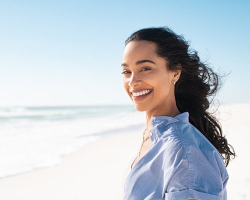 Lady smiles on beach